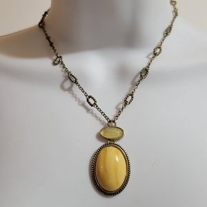 Brass necklace w/polished stone cabochon and faceted glass pendant.